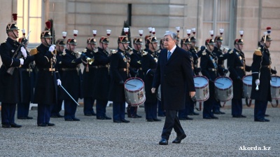 Kazakh President Tokayev meets with Putin, Macron on first foreign tour after re-election