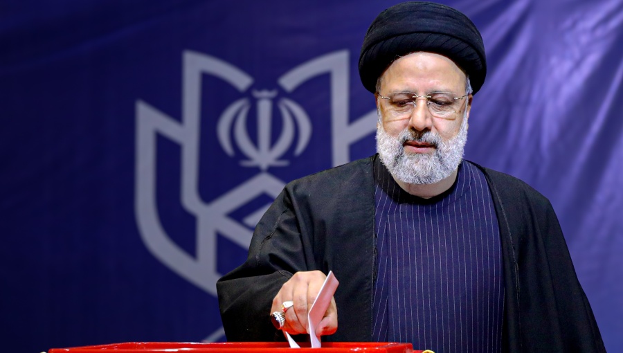 Iranian President Ebrahim Raisi votes in election amid growing calls for change in rules.