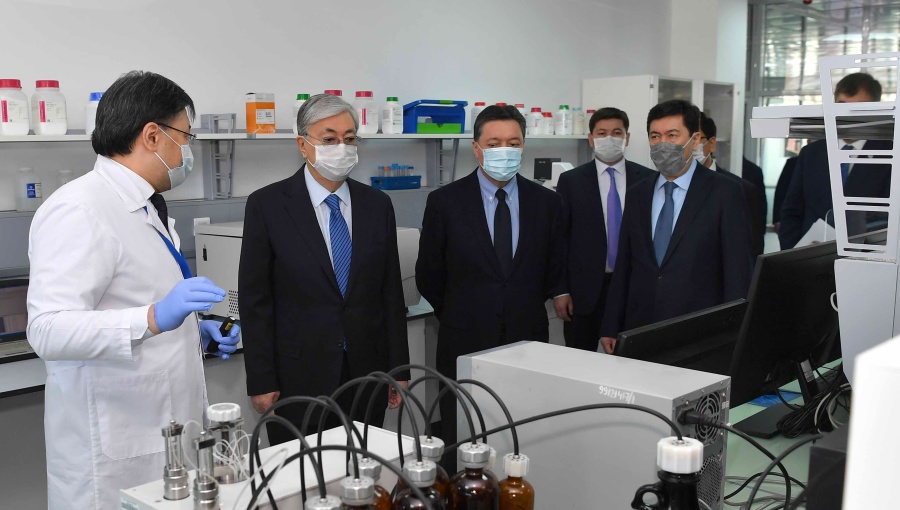 Kazakh President Kassym-Jomart Tokayev (second from left) visiting the National Centre for Biotechnology where efforts are under way to develop testing kits for diagnosing COVID-19.