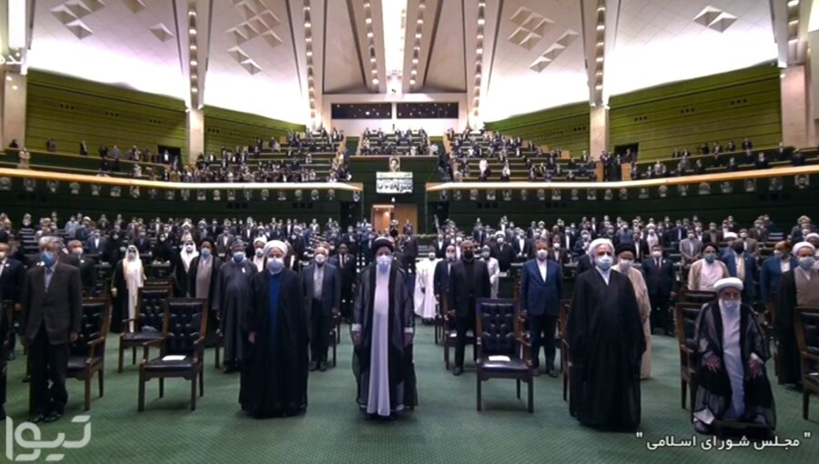 Raisi (centre) at the inauguration ceremony. Many Iranians will give him a cool welcome.