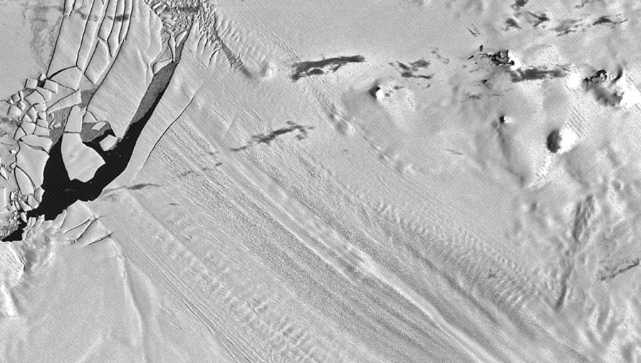 1973 satellite image of Antarctica's Pine Island Glacier ice shelf showing several visible bumps on the ice surface