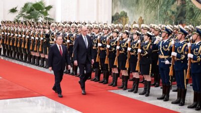 German Chancellor faces calls for tougher China stance as he arrives in Beijing