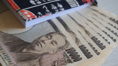Bank of Japan holds interest rate as inflation projections rise
