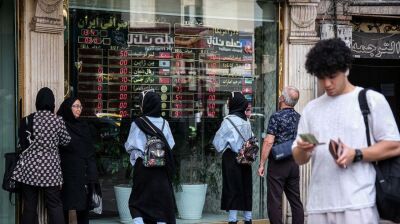 Counterfeit dollars and cash hoarding disrupt Tehran currency market