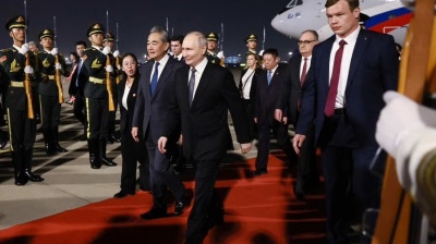 Putin arrives in Beijing with high powered delegation 
