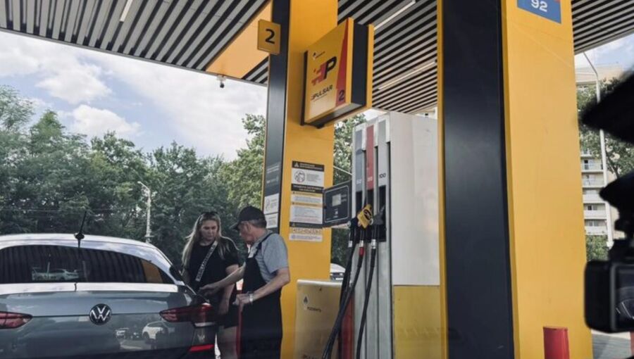 Woman gets fuel in St Petersburg fuel station. 