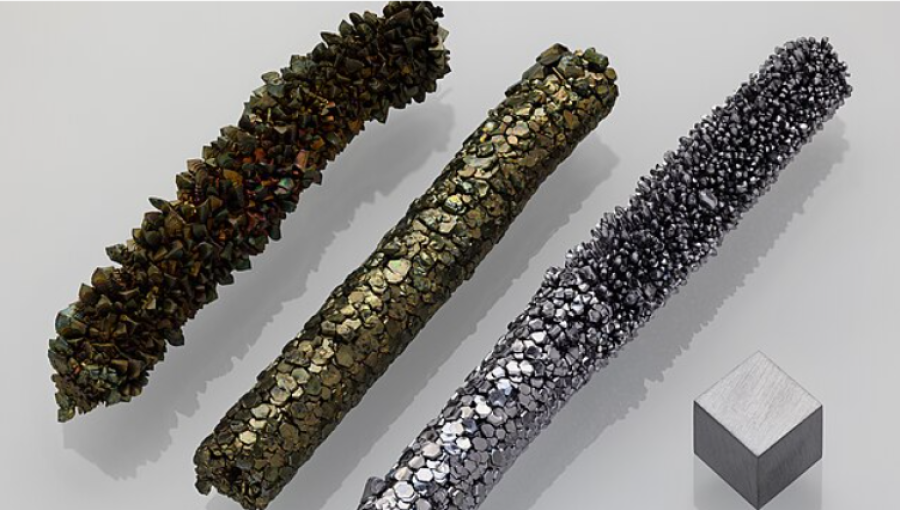 Purest vanadium 99.9%. Three samples of a crystal bar showing different crystal textures and an on air greenish oxidized surface.