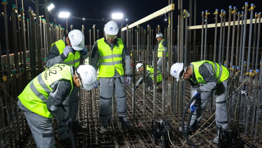Rosatom and Uzatom employees pour concrete during a symbolic groundbreaking ceremony for Uzbekistan’s first nuclear power plant on June 4. Just three months later, it is clear that Uzbekistan is having second thoughts about its selection of Rosatom for this project.