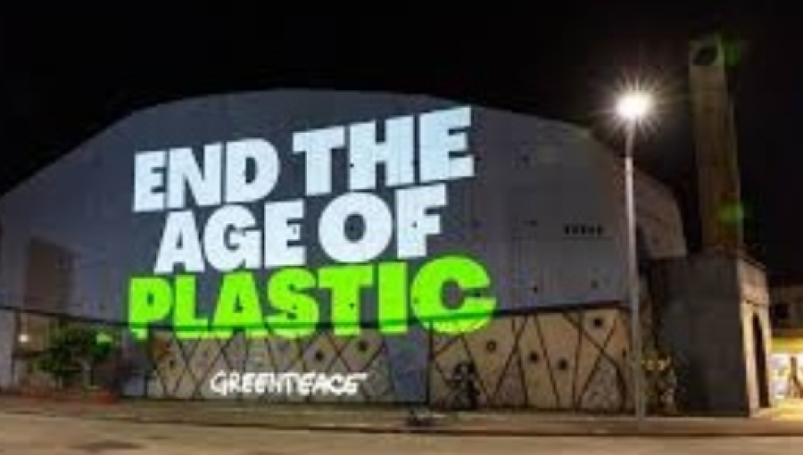 A projection shone on a plastics manufacturing facility by Greenpeace activists. The group says it wants action not words in ending the plastic garbage environmental shame.